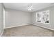 Well-lit bedroom with neutral walls and plush carpeting at 6603 Wandering Creek Dr, Charlotte, NC 28216