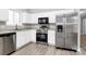 Modern kitchen featuring stainless steel appliances and white cabinetry at 6603 Wandering Creek Dr, Charlotte, NC 28216