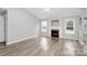 Spacious living room featuring a fireplace and neutral color scheme at 6603 Wandering Creek Dr, Charlotte, NC 28216