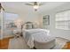 Bedroom with a ceiling fan, light wooden floors, and a comfy bed at 6633 Old Reid Rd, Charlotte, NC 28210