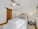 Bedroom with sliding barn door, light wooden floors, and a comfy bed at 6633 Old Reid Rd, Charlotte, NC 28210