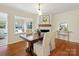 Dining area with a wood table, fireplace, and hardwood floors at 6633 Old Reid Rd, Charlotte, NC 28210