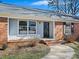 Inviting front entrance with brick steps and a black door at 6633 Old Reid Rd, Charlotte, NC 28210