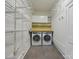 Laundry room offers ample shelving and a modern washer and dryer at 6633 Old Reid Rd, Charlotte, NC 28210