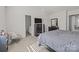 Bright bedroom with a king bed and en-suite bathroom at 8138 Paw Club Dr, Charlotte, NC 28214