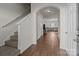 Bright entryway with hardwood floors and view of living room at 8138 Paw Club Dr, Charlotte, NC 28214