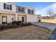 Two-story townhome with attached garage and landscaping at 8138 Paw Club Dr, Charlotte, NC 28214