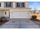 Attached two-car garage with white door at 8138 Paw Club Dr, Charlotte, NC 28214