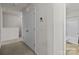 Hallway with double door closet and access to bathroom at 8138 Paw Club Dr, Charlotte, NC 28214