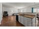 Kitchen features a breakfast bar and granite countertops at 8138 Paw Club Dr, Charlotte, NC 28214