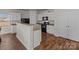 Modern kitchen featuring granite countertops and white cabinets at 8138 Paw Club Dr, Charlotte, NC 28214