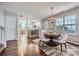 Elegant dining room with chandelier, hardwood floors, and views into the adjacent rooms at 8636 Robinson Forest Dr, Charlotte, NC 28277