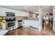 Modern kitchen with stainless appliances, tile backsplash, and ample cabinet space at 8636 Robinson Forest Dr, Charlotte, NC 28277