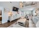 Bright living room featuring a high ceiling, hardwood floors, and comfortable furnishings at 8636 Robinson Forest Dr, Charlotte, NC 28277