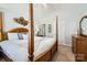 Comfortable main bedroom featuring a four-poster bed and neutral decor at 8636 Robinson Forest Dr, Charlotte, NC 28277