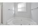 Relaxing bathtub with shower access in this clean bathroom at 9150 Austin Ridge Ln, Charlotte, NC 28214