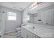 Clean bathroom with vanity, tub, and tiled floor at 9150 Austin Ridge Ln, Charlotte, NC 28214