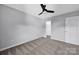 Well-lit bedroom, featuring ceiling fan and carpet flooring at 9150 Austin Ridge Ln, Charlotte, NC 28214