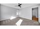 Well-lit bedroom with carpet flooring and ceiling fan at 9150 Austin Ridge Ln, Charlotte, NC 28214