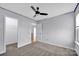 Spacious bedroom with carpet, ceiling fan, and closet at 9150 Austin Ridge Ln, Charlotte, NC 28214