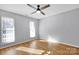 Light gray walls, hardwood floors, and two windows with blinds at 9150 Austin Ridge Ln, Charlotte, NC 28214