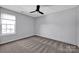 Bright bedroom with ceiling fan and carpet flooring at 9150 Austin Ridge Ln, Charlotte, NC 28214