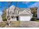 Two-story house with gray siding, white trim, and a two-car garage at 9150 Austin Ridge Ln, Charlotte, NC 28214