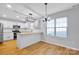 Modern kitchen with white cabinets, granite countertops, and stainless steel appliances at 9150 Austin Ridge Ln, Charlotte, NC 28214