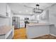 Modern kitchen with white cabinets, granite countertops, and stainless steel appliances at 9150 Austin Ridge Ln, Charlotte, NC 28214