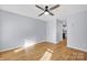 Light gray walls, hardwood floors, and a ceiling fan at 9150 Austin Ridge Ln, Charlotte, NC 28214