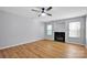 Living area with fireplace and ceiling fan at 9150 Austin Ridge Ln, Charlotte, NC 28214