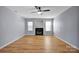 Living room featuring a fireplace and ceiling fan at 9150 Austin Ridge Ln, Charlotte, NC 28214