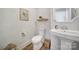 Elegant powder room with stylish wallpaper and pedestal sink at 925 Gray Hook Dr, Fort Mill, SC 29708