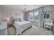 Charming bedroom with pink gingham accent wall and cozy bedding at 925 Gray Hook Dr, Fort Mill, SC 29708