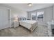 Cozy bedroom with double windows, carpeted floor and wicker furniture at 925 Gray Hook Dr, Fort Mill, SC 29708