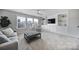 Light-filled bonus room, featuring a comfy seating area and built-in shelving at 925 Gray Hook Dr, Fort Mill, SC 29708