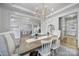 Bright dining room with chandelier, view of kitchen and playroom at 925 Gray Hook Dr, Fort Mill, SC 29708