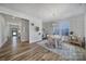 Bright dining room with hardwood floors and a stylish chandelier at 925 Gray Hook Dr, Fort Mill, SC 29708