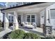 Inviting front porch with a swing and stone pillars at 925 Gray Hook Dr, Fort Mill, SC 29708