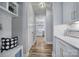 Bright hallway with stylish built-in bench and view into kitchen at 925 Gray Hook Dr, Fort Mill, SC 29708