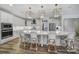 Modern kitchen with white cabinets, large island, and pendant lights at 925 Gray Hook Dr, Fort Mill, SC 29708