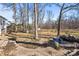 Landscaped backyard with pond feature and trees at 9600 Kayce Ln, Charlotte, NC 28213