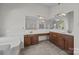 Bathroom with double vanity and tile flooring at 9600 Kayce Ln, Charlotte, NC 28213