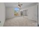 Bedroom with mirrored closet and large window at 9600 Kayce Ln, Charlotte, NC 28213