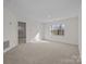 Bright bedroom with window and access to another room at 9600 Kayce Ln, Charlotte, NC 28213