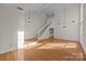 Bright dining room with hardwood floors and a view of the staircase at 9600 Kayce Ln, Charlotte, NC 28213