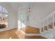 Bright entryway with hardwood floors, a staircase, and a large window at 9600 Kayce Ln, Charlotte, NC 28213