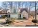 Two-story house with gray siding, a white garage door, and landscaping at 9600 Kayce Ln, Charlotte, NC 28213