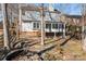 House exterior with sunroom and pond feature at 9600 Kayce Ln, Charlotte, NC 28213