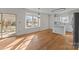 Kitchen features white cabinets, an island, and hardwood floors at 9600 Kayce Ln, Charlotte, NC 28213